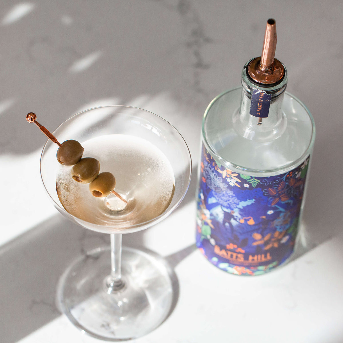 Batts Hill Surrey Dry Gin Dirty Martini with olive garnish