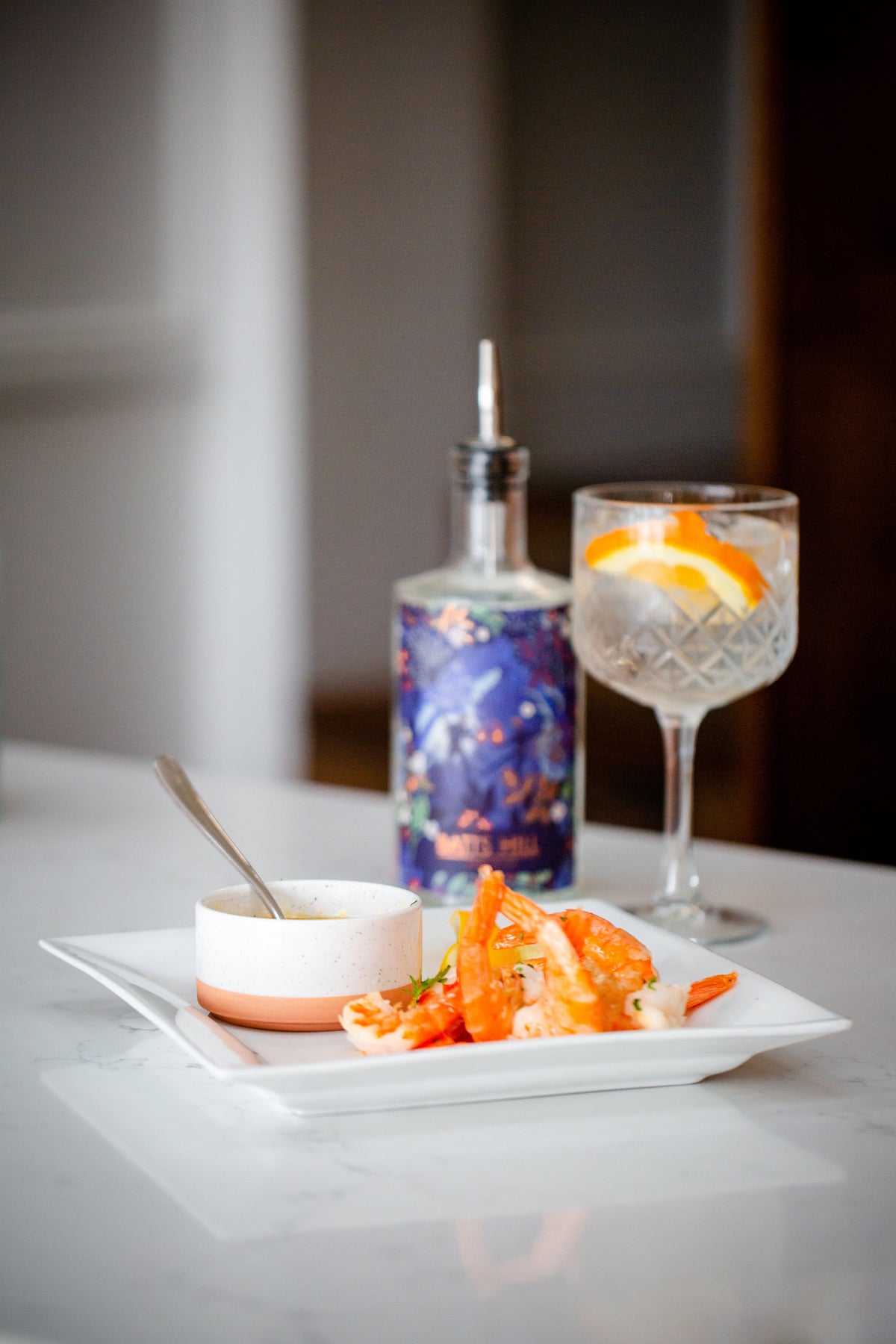 Batts Hill Surrey Dry Gin flambeed tiger prawns with garlic lemon butter