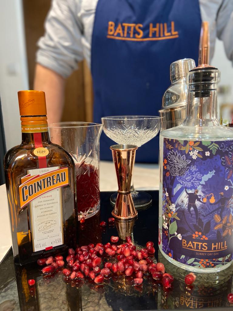 Batts Hill Surrey Dry Gin Pomegranate Martini with orange and pomegranate garnish